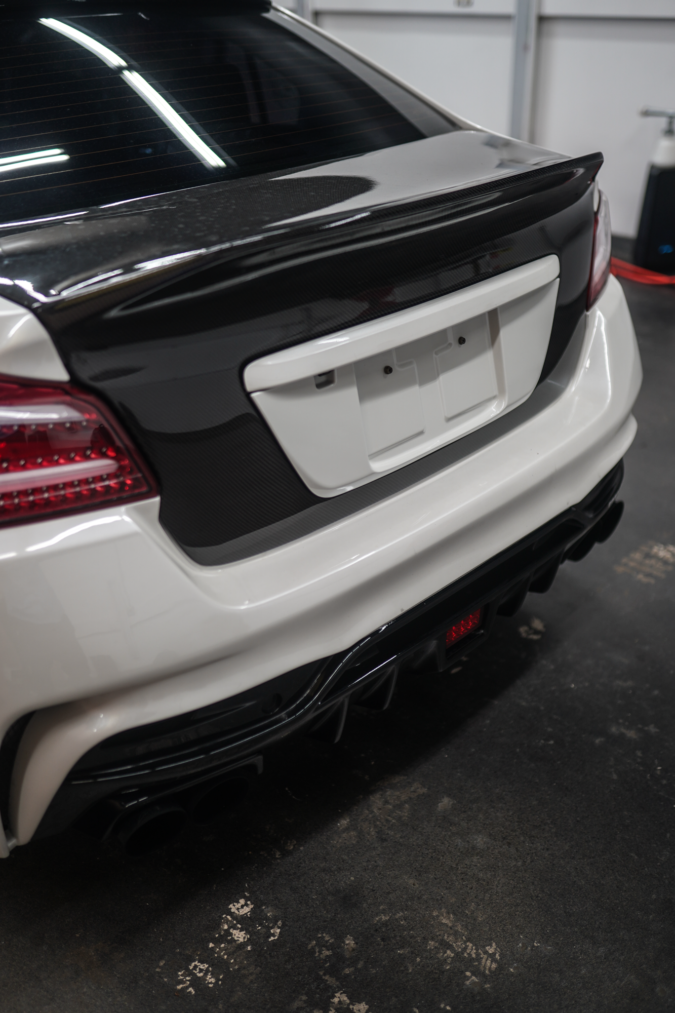 JDMuscle Gloss Black / Paint Matched License Plate Backing - 15-21 WRX/STI