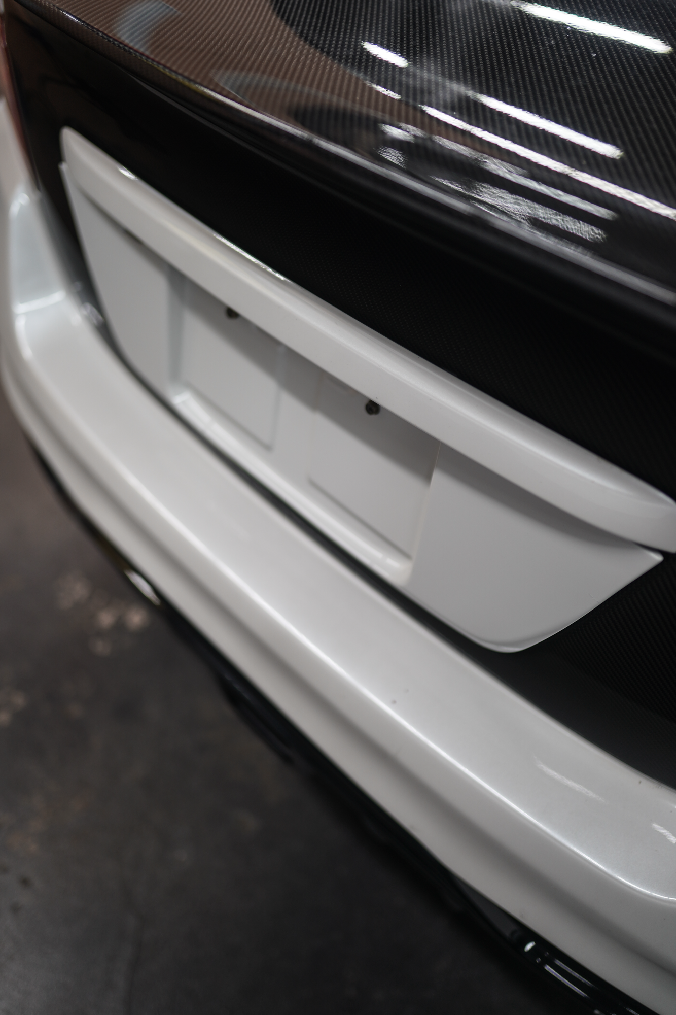 JDMuscle Gloss Black / Paint Matched License Plate Backing - 15-21 WRX/STI