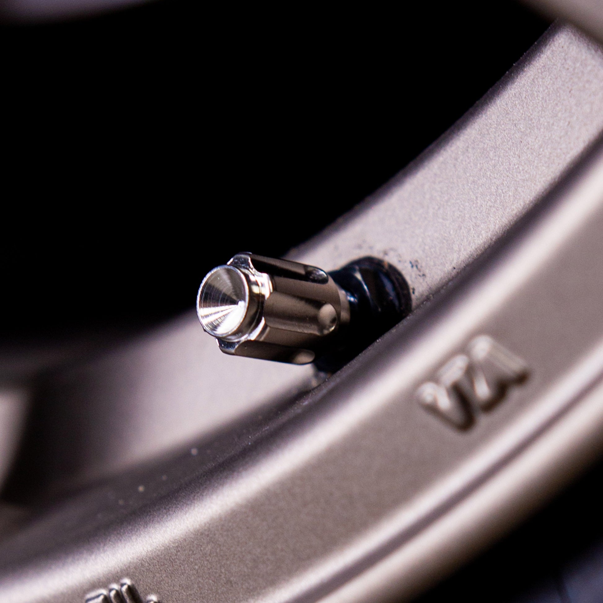 Titanium Gear Valve Stem Cap - Graveyard Performance