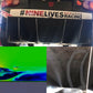A rear view of a V8 Miata racing car features a "#9livesracing" bumper sticker and displays the Miata Diffuser '90-05 NA/NB from 9livesracing. Below are two smaller images emphasizing aerodynamics: one shows a computer simulation with airflow visualization, and the other depicts the car's underside with wind tunnel testing marks.