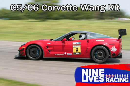 A red Chevrolet Corvette, outfitted with the Corvette Big Wang Chassis Mount ’97-13 C5/6 by 9livesracing, speeds down a track. The car showcases the number 3, sponsor stickers, and a prominent extruded aluminum rear spoiler for an optimized lift-to-drag ratio. The image includes the text "C5/C6 Corvette Wang Kit" at the top and "Nine Lives Racing" at the bottom right.