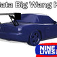 A stylized image of a blue Mazda Miata featuring a large rear wing, often called a "big wang." The text "Miata Big Wang Kit '90-05 NA/NB" proudly showcasing its down-force capabilities is at the top, while the "9livesracing" logo, emphasizing its American-made quality, is located in the bottom right corner.