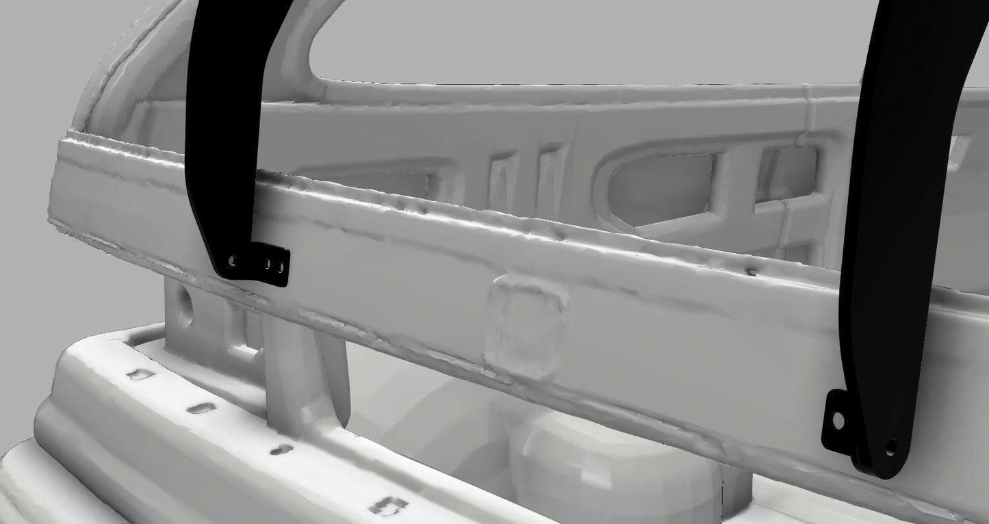 A close-up view of the 9livesracing Civic Hatch EF Wang kit (88-91) reveals a white metal structure, accented with black brackets at various points. The design includes a curved bar and rectangular cutouts, showcasing visible welds and bolts. This component is specifically engineered to enhance down-force for improved vehicle performance. It is set against a gray background.
