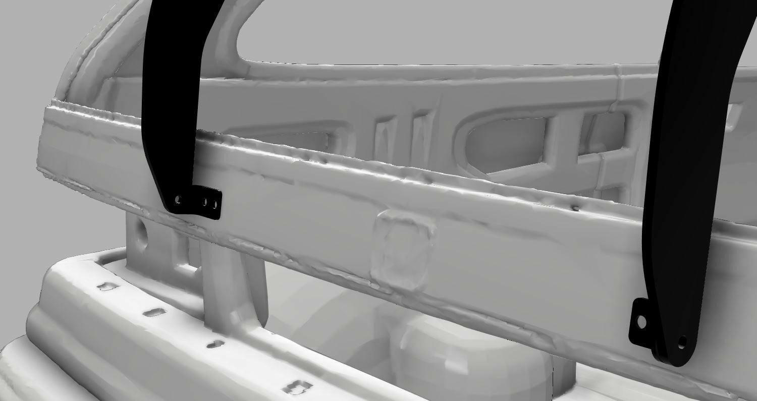 A close-up view of the 9livesracing Civic Hatch EF Wang kit (88-91) reveals a white metal structure, accented with black brackets at various points. The design includes a curved bar and rectangular cutouts, showcasing visible welds and bolts. This component is specifically engineered to enhance down-force for improved vehicle performance. It is set against a gray background.
