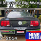 A black Ford Mustang race car with a large rear wing, adorned with sponsor decals. The text at the top reads "Mustang Big Wang Kit '05-09 S197," and at the bottom, "2005 - 2014." The "9livesracing" logo is located at the bottom right corner, along with other sponsor names and logos on the car.