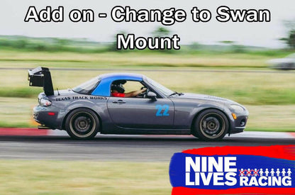 A gray race car with a large black spoiler, numbered 22 on the door and displaying "Texas Track Works" on the side, speeds down the racetrack. "Add on - Change to Swan Mount" is written at the top. The logo for 9livesracing, known for their Miata Big Wang Kit '06-15 NC (V2), appears in the bottom right corner, showcasing their expertise in racing aerodynamics.