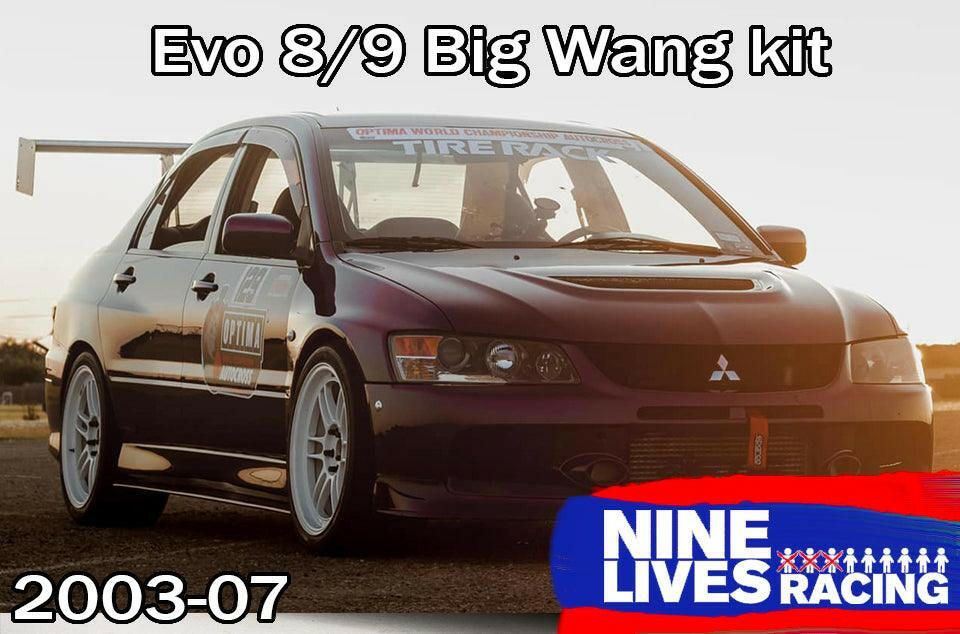 A dark-colored Mitsubishi Lancer Evolution 8/9 is featured with an "Evolution 8/9 Big Wang kit ’03-07 CT9A" and aluminum wings. The car showcases white wheels, various stickers including "Tire Rack," and a substantial rear wing to boost down-force. Text reads "Evolution 8/9 Big Wang kit ’03-07 CT9A," "9livesracing," and "2003-07.