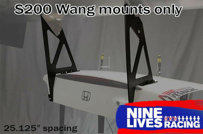 Image showing two black Honda S2000 Trunk Mounts - Pylons only positioned parallel on a car part with a Honda logo. Text includes "Honda S2000 mounts only," "25.125” spacing," and "9livesracing," with the latter in a blue and red logo at the bottom right, highlighting the 9livesracing mount kit.