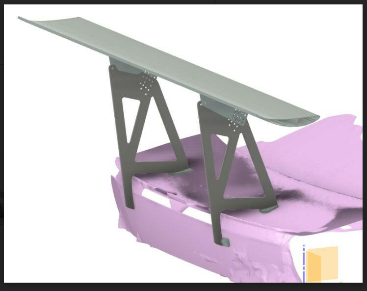 A digital rendering of a car's trunk area showcases a large aerodynamic spoiler for maximum downforce. The light purple trunk highlights the 9livesracing 3-Series Big Wang kit '14-18 F80 / F82 / F83, while the grey spoiler, supported by extruded aluminum wings, adds a sleek touch. A small beige box icon sits at the bottom right for detail.