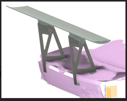 A digital rendering of a car's trunk area showcases a large aerodynamic spoiler for maximum downforce. The light purple trunk highlights the 9livesracing 3-Series Big Wang kit '14-18 F80 / F82 / F83, while the grey spoiler, supported by extruded aluminum wings, adds a sleek touch. A small beige box icon sits at the bottom right for detail.