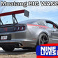 A grey Ford Mustang with a large rear wing and race decals, including the number 14, is parked outdoors. A banner at the top reads "Mustang Big Wang Kit '10-14 S197 II," and the bottom right has a "9livesracing" logo.