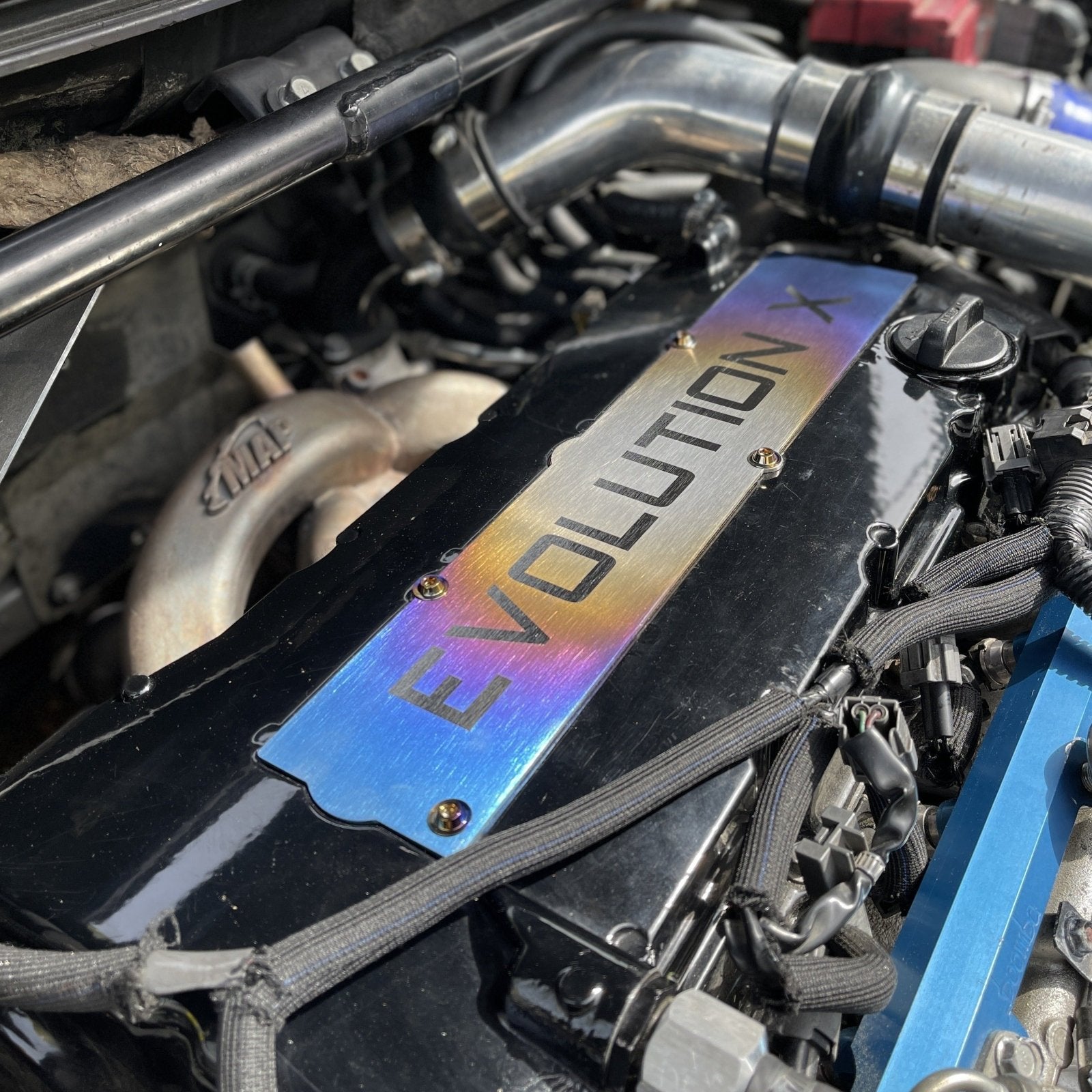 JDC Titanium Spark Plug Cover (Evo X) - Graveyard Performance