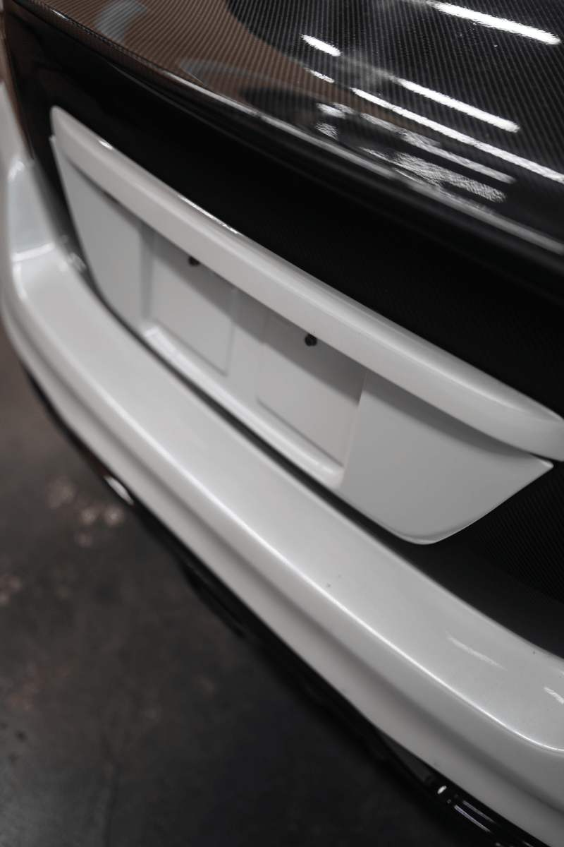 JDMuscle [15-21 WRX/STI] Gloss Black / Paint Matched License Plate Backing - Graveyard Performance