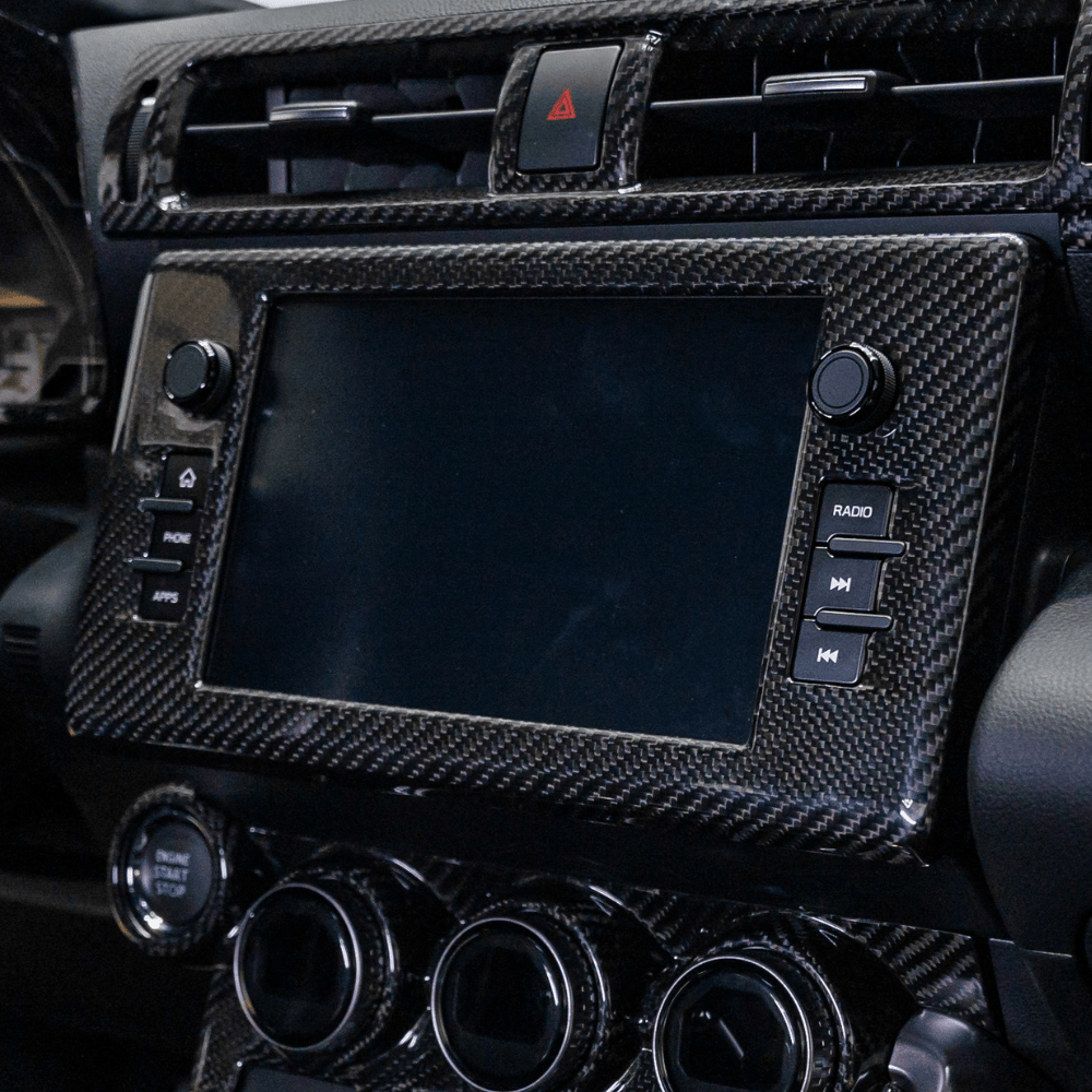 JDMuscle [[22-26 BRZ/GR86]] Tanso Pre-preg Carbon Fiber Center Mutimedia/ Radio Screen Cover w/ Gloss Finish - Graveyard Performance