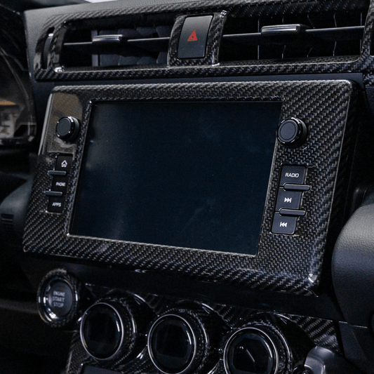 JDMuscle [[22-26 BRZ/GR86]] Tanso Pre-preg Carbon Fiber Center Mutimedia/ Radio Screen Cover w/ Gloss Finish - Graveyard Performance