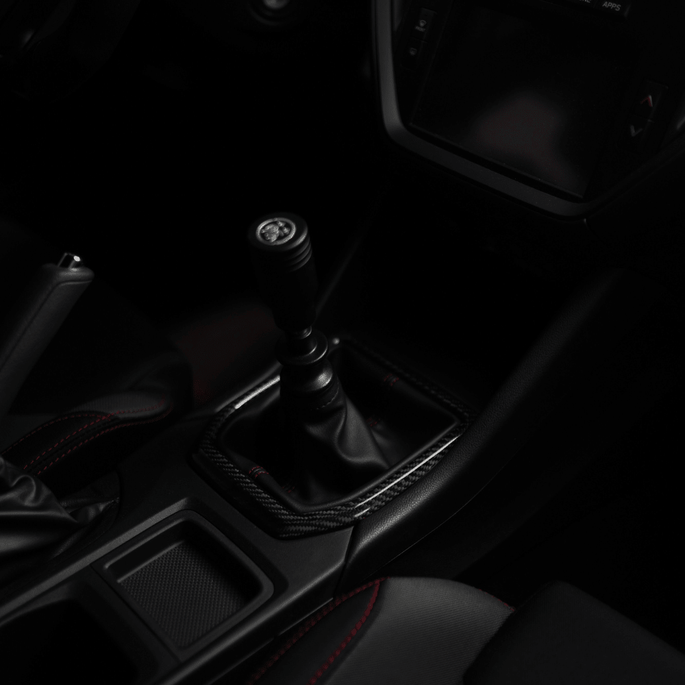 JDMuscle [22-26 WRX] MT Tanso Pre-preg Carbon Fiber Shifter Trim Cover w/ Gloss Finish - Graveyard Performance