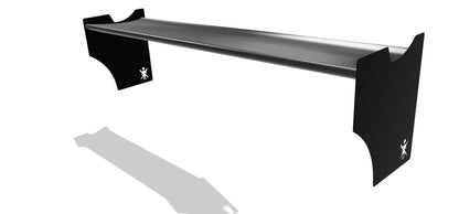 The Ariel Atom Big Wang by 9livesracing is a sleek, minimalist black shelf with black end supports designed like airfoils. The supports are angled outward and feature a small white emblem of a stylized person. This elegant design casts a shadow on a plain white background.