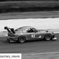 Black and white image of a race car with the number 62, driving on a race track. The 9livesracing Miata Big Wang Kit '90-05 NA/NB enhances its prominent rear wing, optimizing down-force as it appears to be in motion. The Instagram username "zachary_reavis" is visible in the bottom left corner.