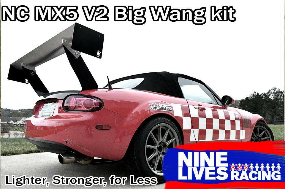 A red Mazda NC MX-5 convertible is featured in this image with a striking performance wing. The car sports a black convertible top and white checkered decals. The text on the image reads "Miata Big Wang Kit '06-15 NC (V2)" and "9livesracing." At the bottom, it also says, "Lighter, Stronger, for Less.