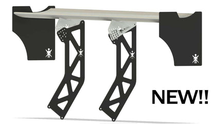 Introducing the DF Goblin Big Wang Kit by 9livesracing: A contemporary, black metal wall-mounted surfboard rack with a sleek design and "NEW!!" boldly printed in black on the right side. This rack features stylish geometric cutouts, aluminum wings for added flair, and a small logo of a stick figure holding a surfboard.
