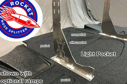 Image of a Corvette Rocket Nose Splitter ’97-04 C5 from 9livesracing with various labeled parts. The metallic Light Pocket piece in the center is surrounded by "pocket", "mo pocket", "other pocket", and optional ramps on a black surface. A CNC cut Corvette Rocket Nose V2 logo is visible in the upper left corner, enhancing downforce and precision.