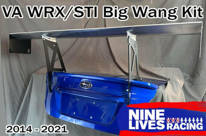 Image of a substantial aluminum rear wing kit mounted on the trunk lid of a blue Subaru WRX/STI, designed for models from 2014 to 2021. Text reads "Subaru Impreza / WRX / STI Big Wang kit 14-21 VA" and "9livesracing" accompanied by their logo in the bottom right corner, enhancing downforce for your Subaru.