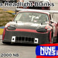 A red race car with a heavily modified front bumper and headlight blanks races on a track. Crafted from robust plastic, the text reads "Miata Headlight Blanks NB1-Only," "1999-2000 NB," and "Nine Lives Racing.