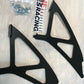 An image features two black metal brackets with multiple cutouts, a bag of screws, a Nine Lives Racing (9livesracing) sticker, and a pack of six small "Do Not Touch" stickers. The items are displayed on a light grey surface next to an extruded aluminum wing, highlighting the 350z Big Wang Kit '02-08 Z33 for superior GT3 performance.